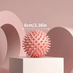 Pink spiky massage ball for muscle relaxation and stress relief
