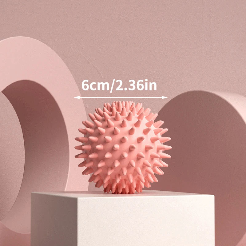 Pink spiky massage ball for muscle relaxation and stress relief