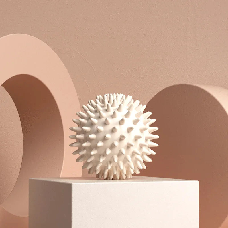 White spiky massage ball for muscle relaxation and physical therapy