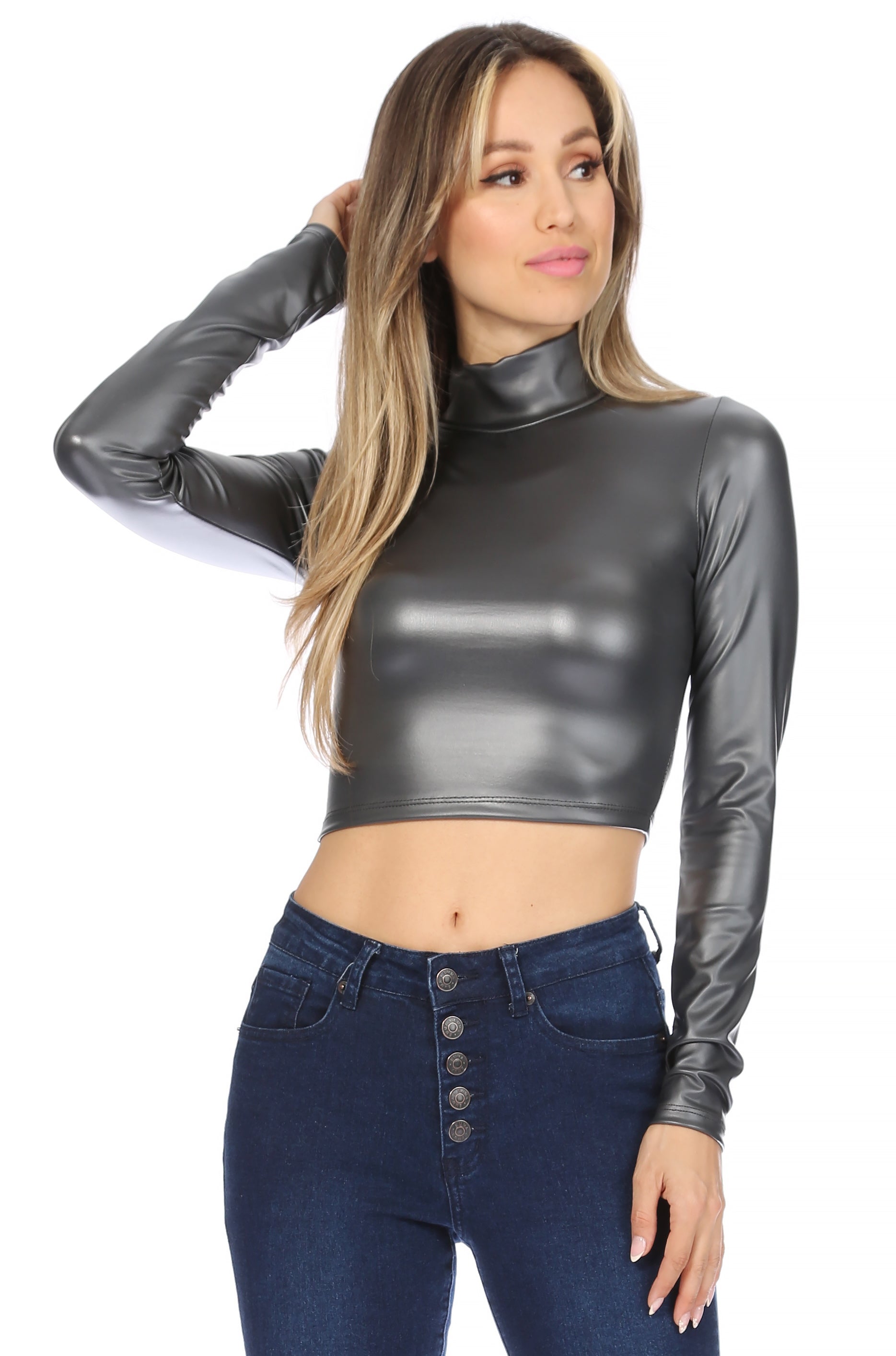 Stylish model wearing a matte black mock neck crop top paired with high-waisted jeans.