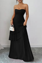 Elegant black strapless dress with layered design for evening events and maxi dress.