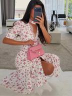 Women's floral print wrap maxi dress, perfect for summer outings.