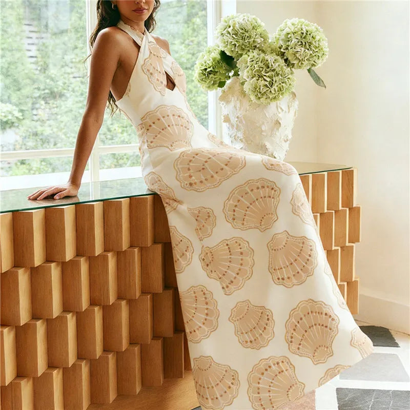Women's white shell print maxi dress, perfect for summer outings.