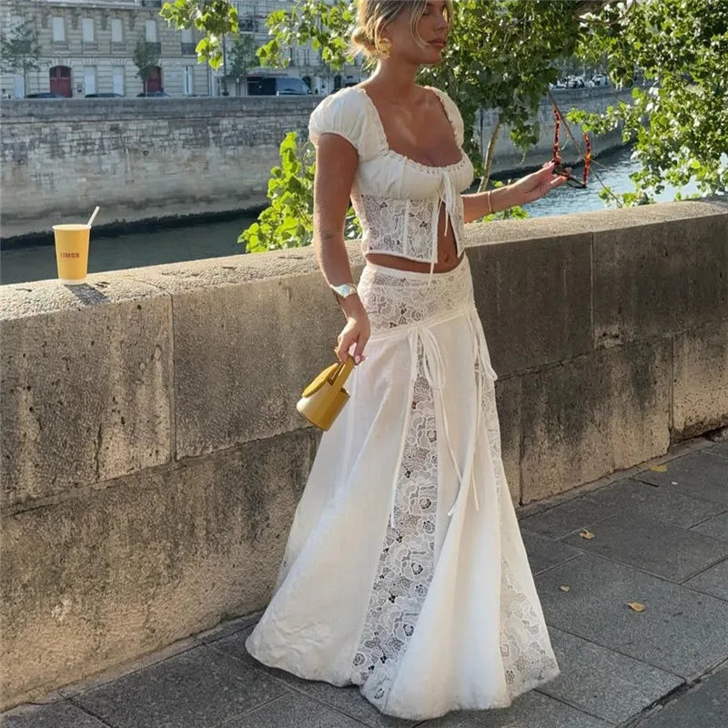 Women's white maxi skirt with lace details, perfect for summer outings