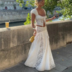Women's white maxi skirt with lace details, perfect for summer outings