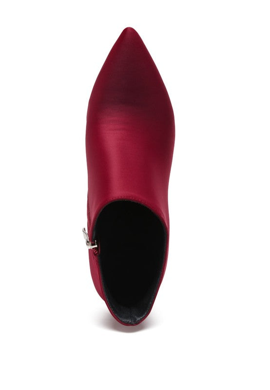 Top view of Melba high heel ankle boot in red satin with a sleek pointed toe design