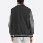 Back view of a Men's Melton varsity jacket by VacationGrabs with striped collar and cuffs