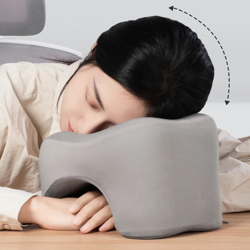 Gray memory foam travel pillow for comfortable napping on the go