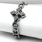 Men's high polished bracelet featuring intricate cross design and unique patterns