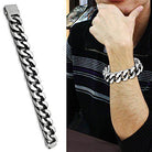Men's high polished bracelet featuring a sleek chain design worn on a man's wrist