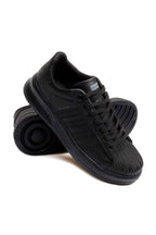 Men's All-Black Leather Low-Top Sneakers with Textured Toe – styled view