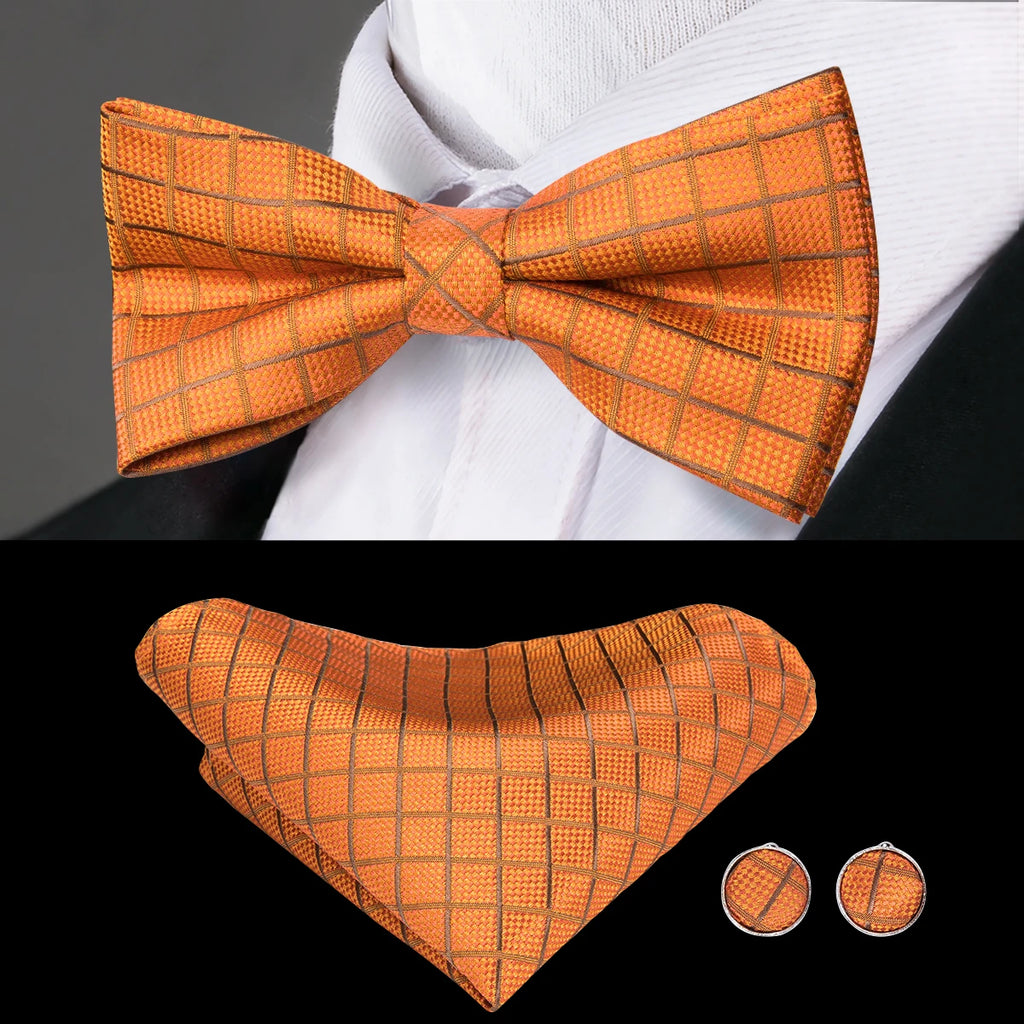 Mens bow tie in orange with matching pocket square and cufflinks for formal occasions