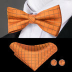 Mens bow tie in orange with matching pocket square and cufflinks for formal occasions