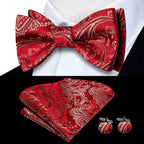 Mens bow tie set in red paisley fabric with pocket square and cufflinks