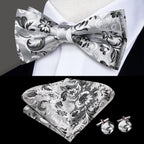 Mens bow tie in silver floral pattern with matching pocket square and cufflinks