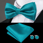 Mens bow tie in teal silk with matching pocket square and cufflinks