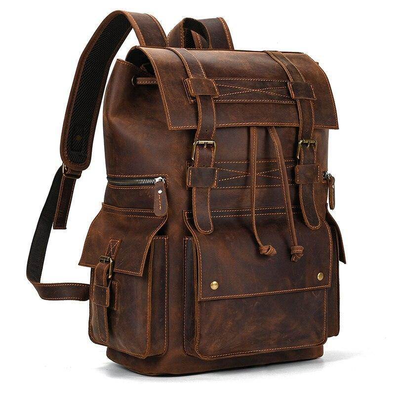 Mens brown leather backpack with multiple pockets and durable design for travel and everyday use