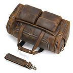 Men's duffle bag in brown leather, perfect for travel and gym use