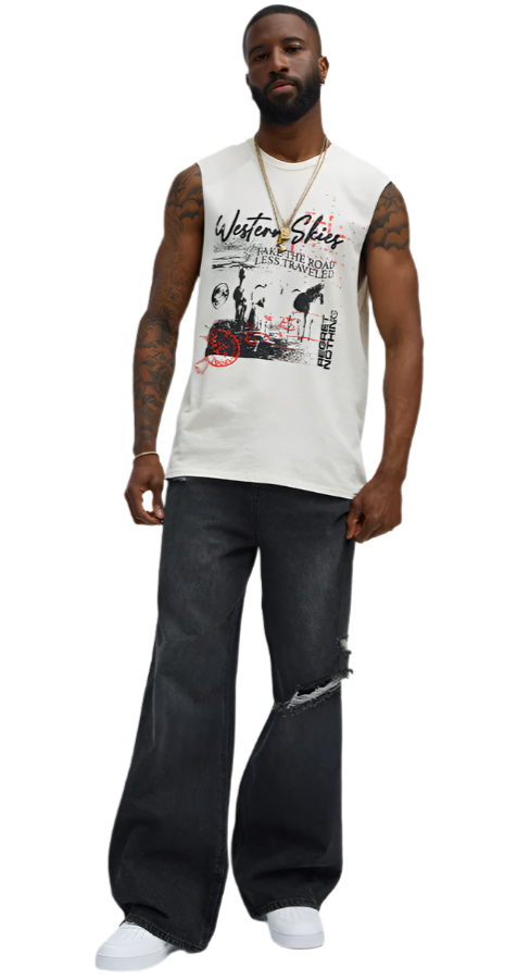 Mens graphic sleeveless shirt in white with black and red design worn with ripped black jeans and white sneakers