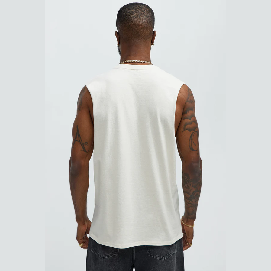 Back view of a mens graphic sleeveless shirt in white worn by a tattooed male model