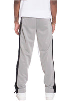 Men's gray snap button track pants by VacationGrabs featuring stylish side stripes and comfortable fit