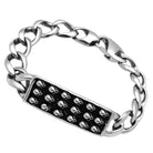 Men's high polished bracelet with black skull accents on a chunky chain design