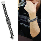 Men's high polished bracelet featuring a unique design on a stainless steel chain worn by a man