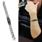 Men's high polished bracelet with intricate design, showcasing a stylish look on a model's wrist