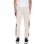 WEIV beige and black mens jogger sweatpants with cuffed ankles worn with black and white sneakers