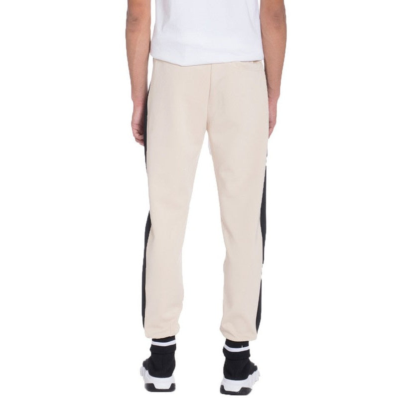 WEIV beige and black mens jogger sweatpants with cuffed ankles worn with black and white sneakers