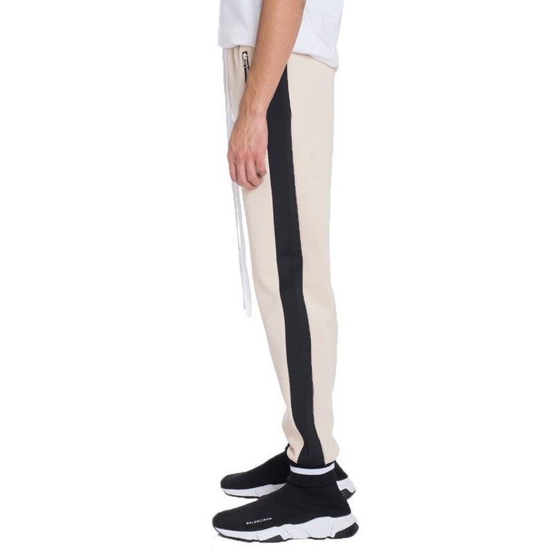 Side view of beige mens jogger sweatpants with black side stripe and zipper pocket