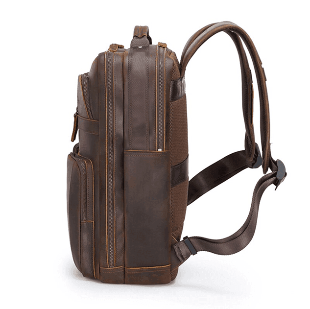 Side view of a stylish mens leather backpack with multiple pockets for everyday use