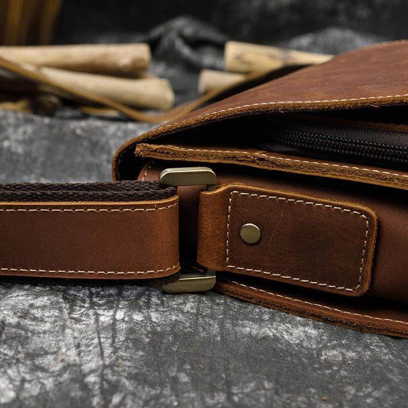 Close-up of mens leather crossbody bags showing sturdy strap and premium stitching detail