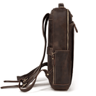Side view of a stylish mens leather laptop backpack featuring multiple pockets and durable straps