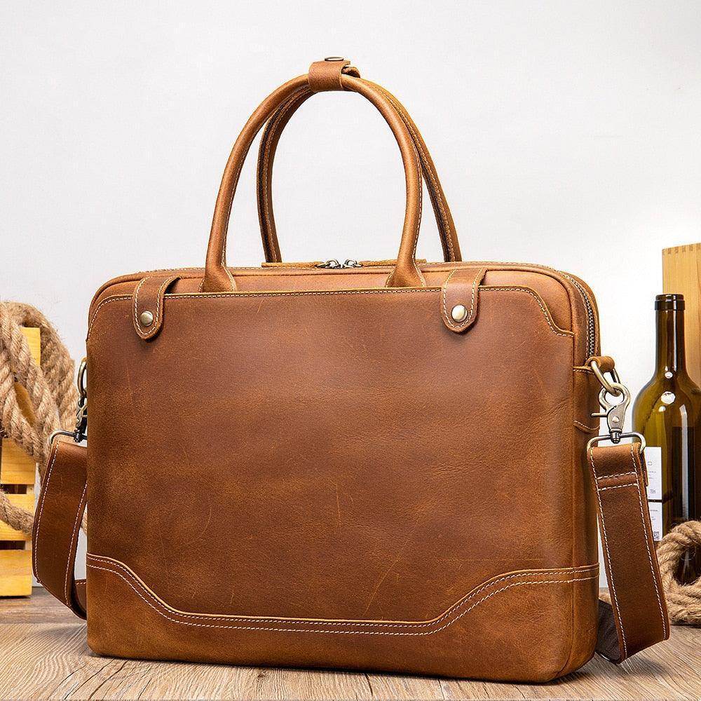 Brown men's leather satchel bag featuring a sturdy design and adjustable shoulder strap for versatile use
