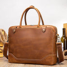 Brown mens leather satchel bag with handles and adjustable shoulder strap for versatile use