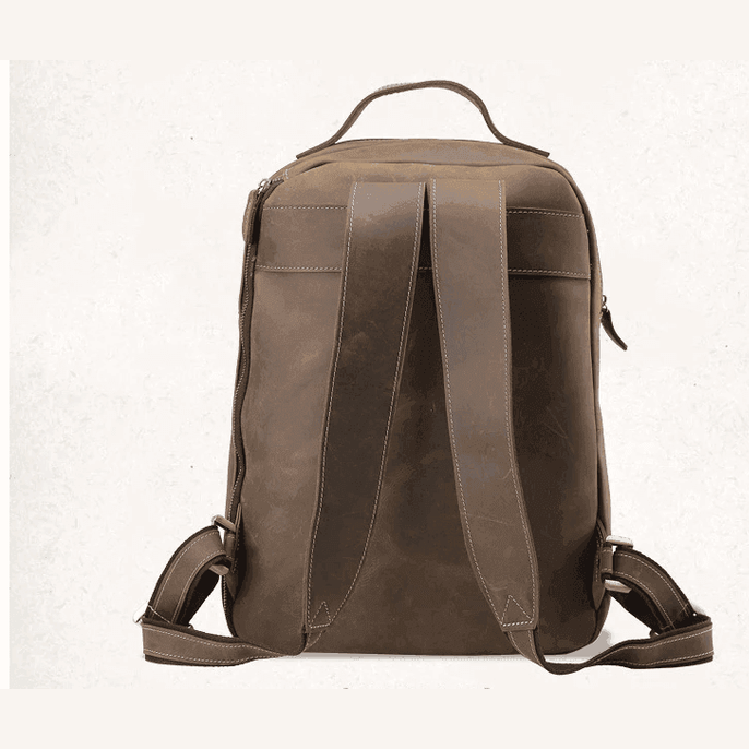 Back view of a mens leather travel backpack with padded straps and sturdy design for comfort and durability