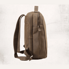 Side view of VacationGrabs mens leather travel backpack with adjustable straps and sleek design