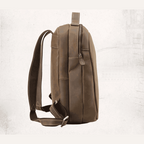 Side view of VacationGrabs mens leather travel backpack with adjustable straps and sleek design