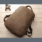 Mens leather travel backpack by VacationGrabs with a spacious design and durable construction