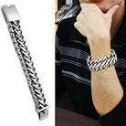 Men's polished stainless steel bracelet showcased on a wrist with a stylish design
