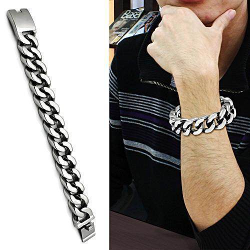 Stylish men's polished stainless steel bracelet worn by a man, featuring a sleek chain design.