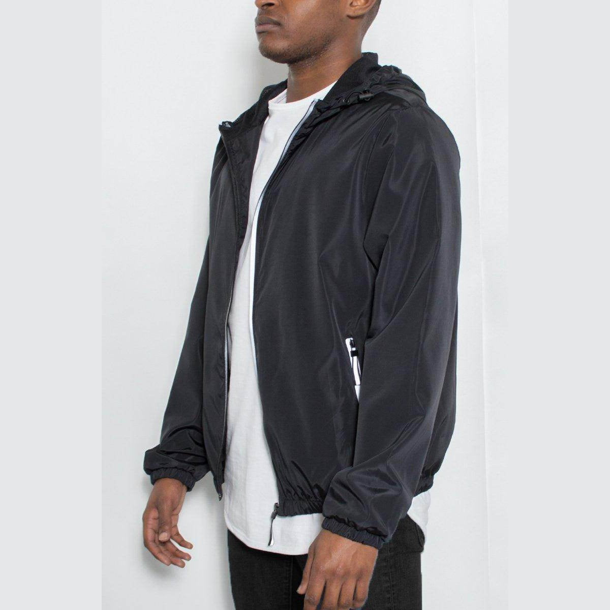 Men's reflective windbreaker jacket in black with adjustable hood and front pockets for outdoor activities