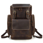 Mens retro laptop backpack in brown leather with multiple pockets and adjustable straps for travel