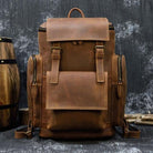 VacationGrabs mens retro laptop backpack in brown leather with multiple compartments for storage