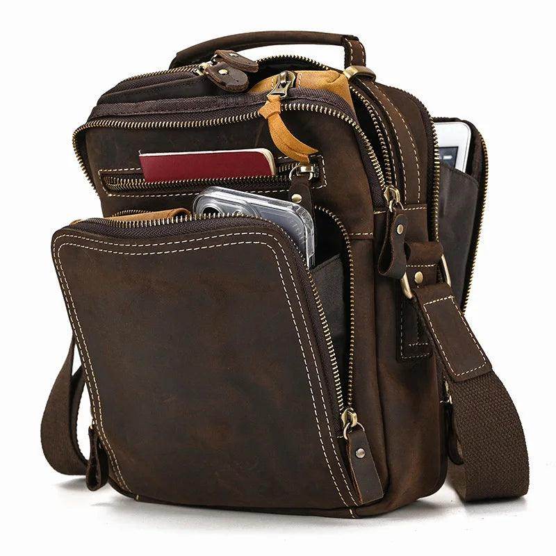 Mens retro leather shoulder bag featuring multiple pockets and an adjustable strap for travel convenience