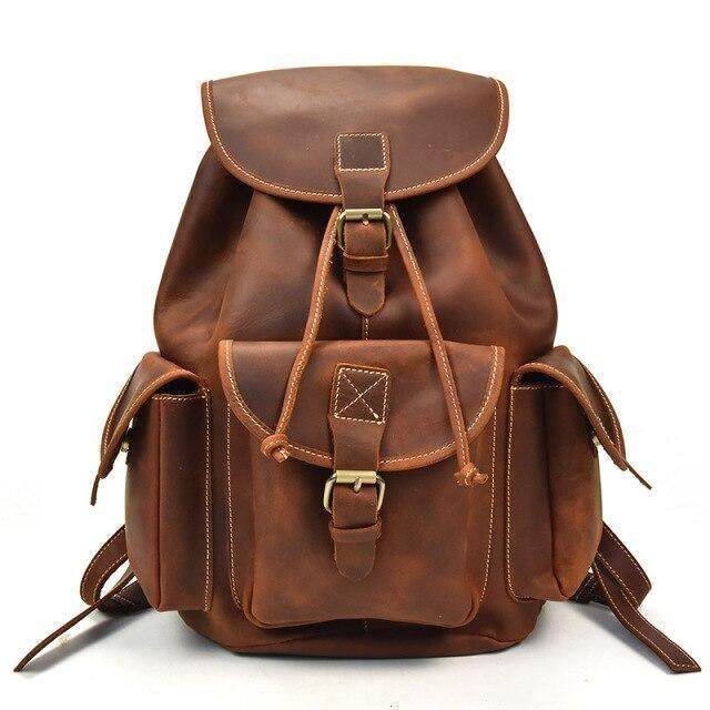 Mens retro rucksack in brown leather with multiple pockets and adjustable straps for stylish storage