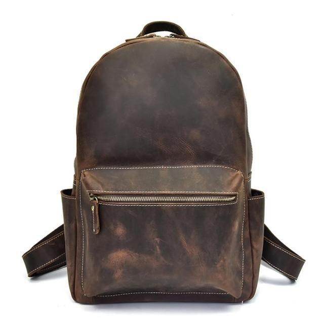 Mens retro rucksack in vintage brown leather with front zipper pocket and adjustable straps