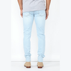 VacationGrabs mens slim fit jeans light blue shown from the back with beige shoes