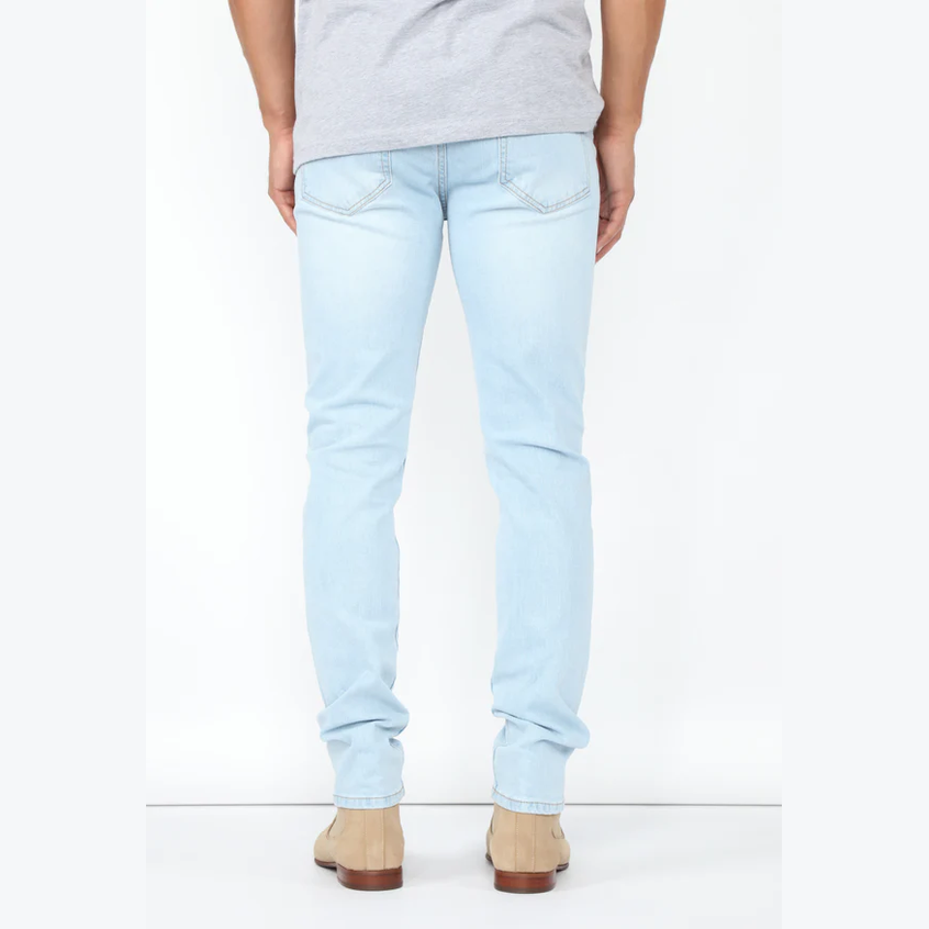 VacationGrabs mens slim fit jeans light blue shown from the back with beige shoes